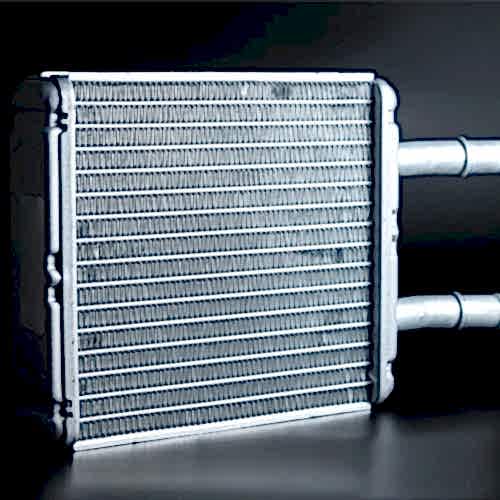 new-interior-heater-radiator-on-a-black-background-aluminum-radiator-spare-parts-blaby