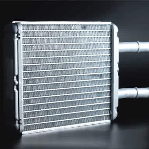 new-interior-heater-radiator-on-a-black-background-aluminum-radiator-spare-parts-cosby