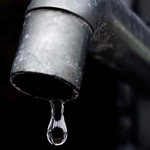 old-leaky-faucet-focus-on-water-drop-Broughton Astley