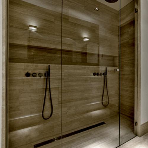 bathroom-with-a-shower-and-a-wooden-door-Broughton Astley