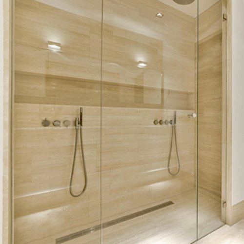 bathroom-with-a-shower-and-a-wooden-door-blaby