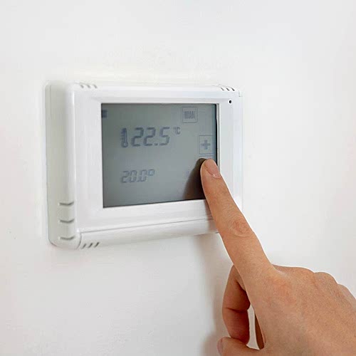 lowering-the-temperature-for-energy-saving-human-hand-adjusting-digital-central-heating-thermostat-at-home-blaby